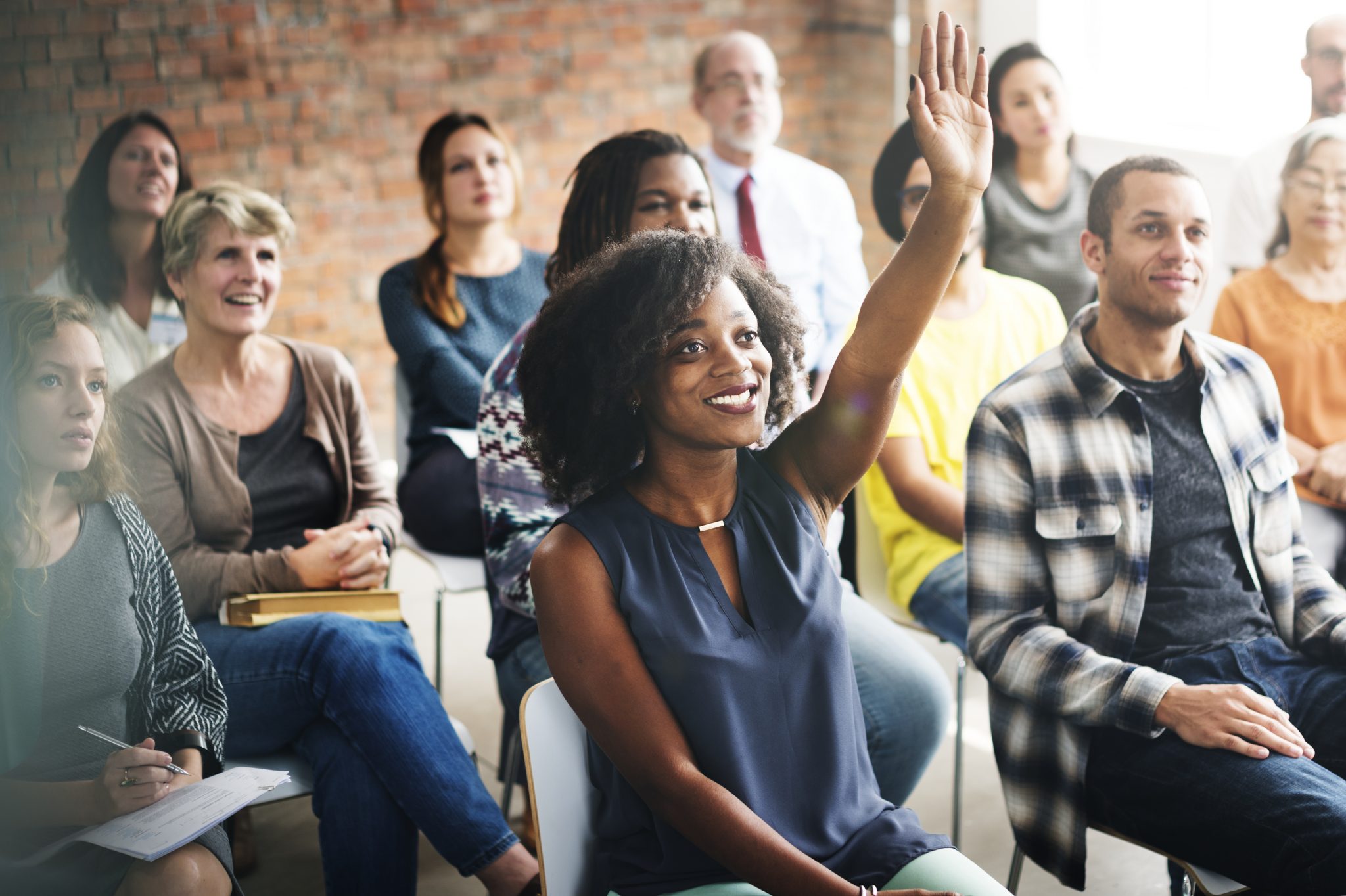 A group of diverse audience in a meeting A group of diverse audience in a meeting